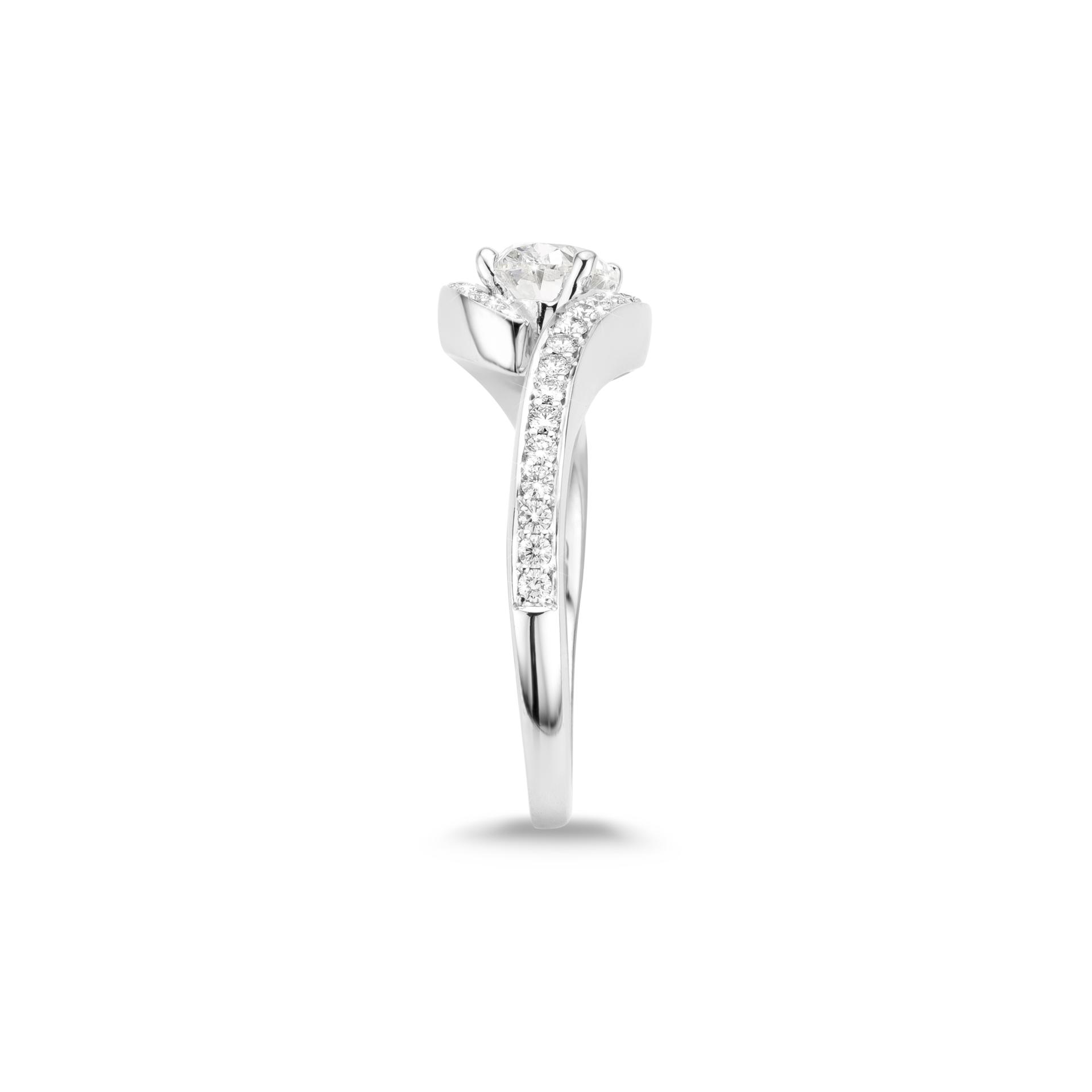 White gold ring set with oval shaped diamond and brilliant cut diamonds made by Maison De Greef