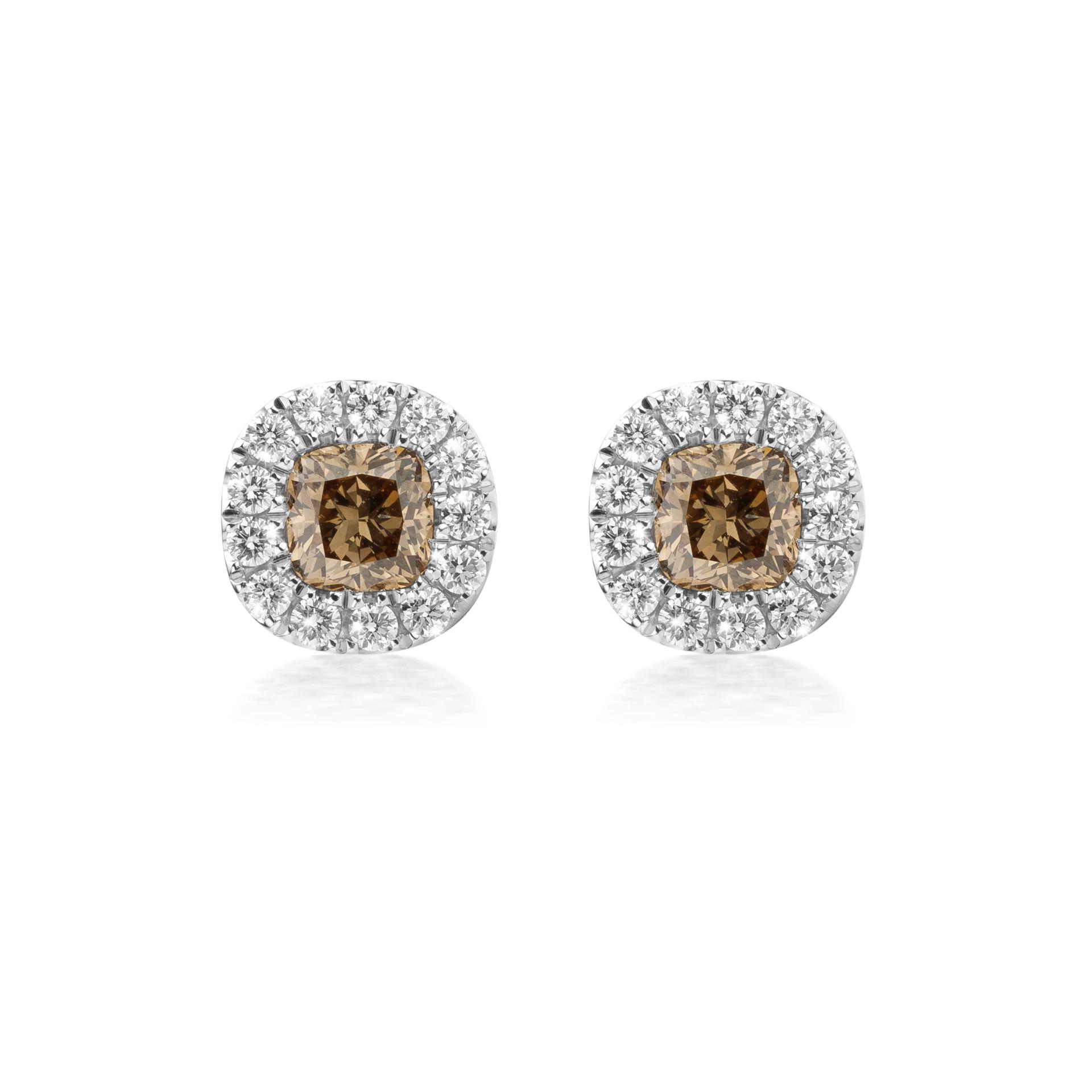 White gold earrings set with cushion cut brown diamonds and brilliant cut diamonds made by Maison De Greef