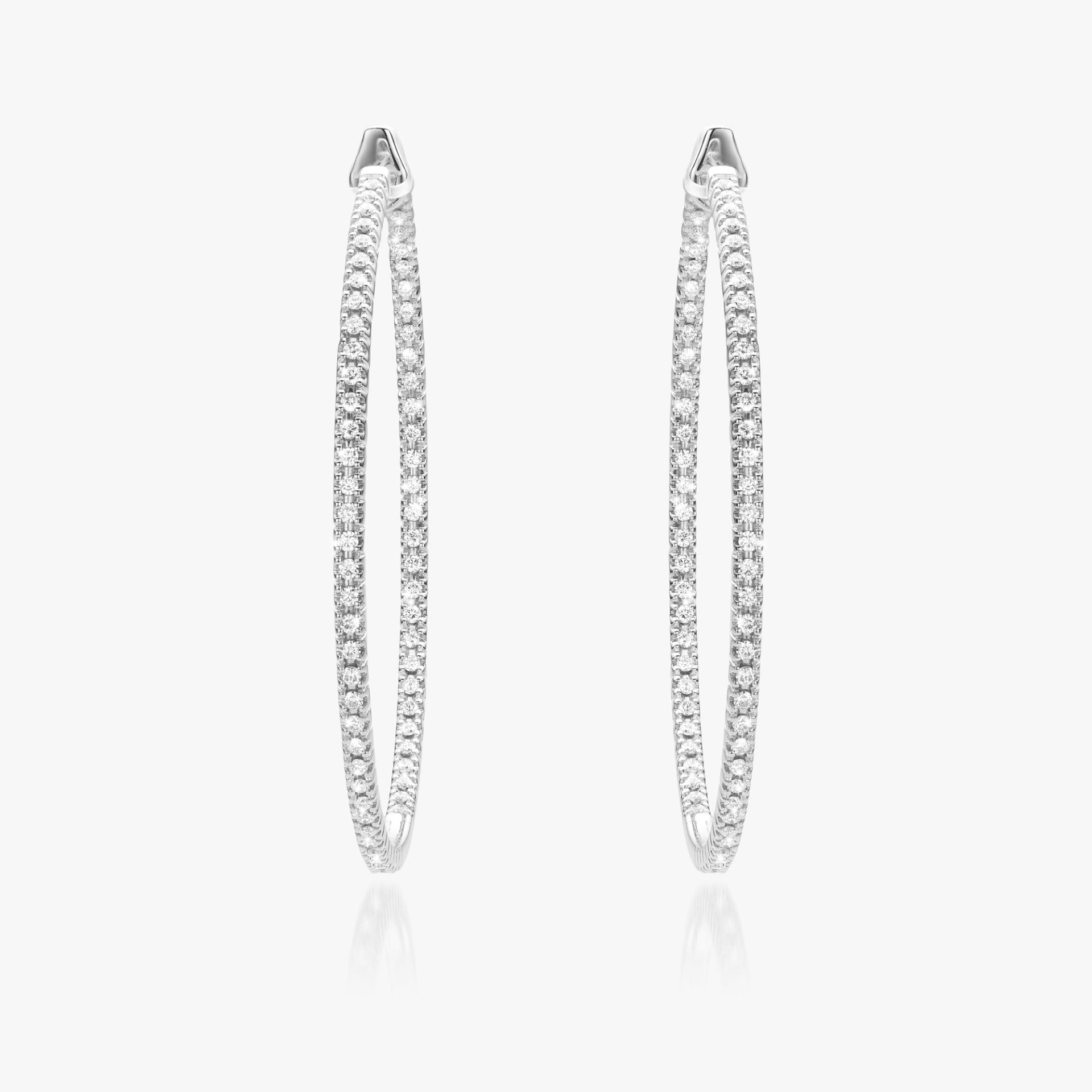 White gold earrings set with brilliants made by Maison De Greef