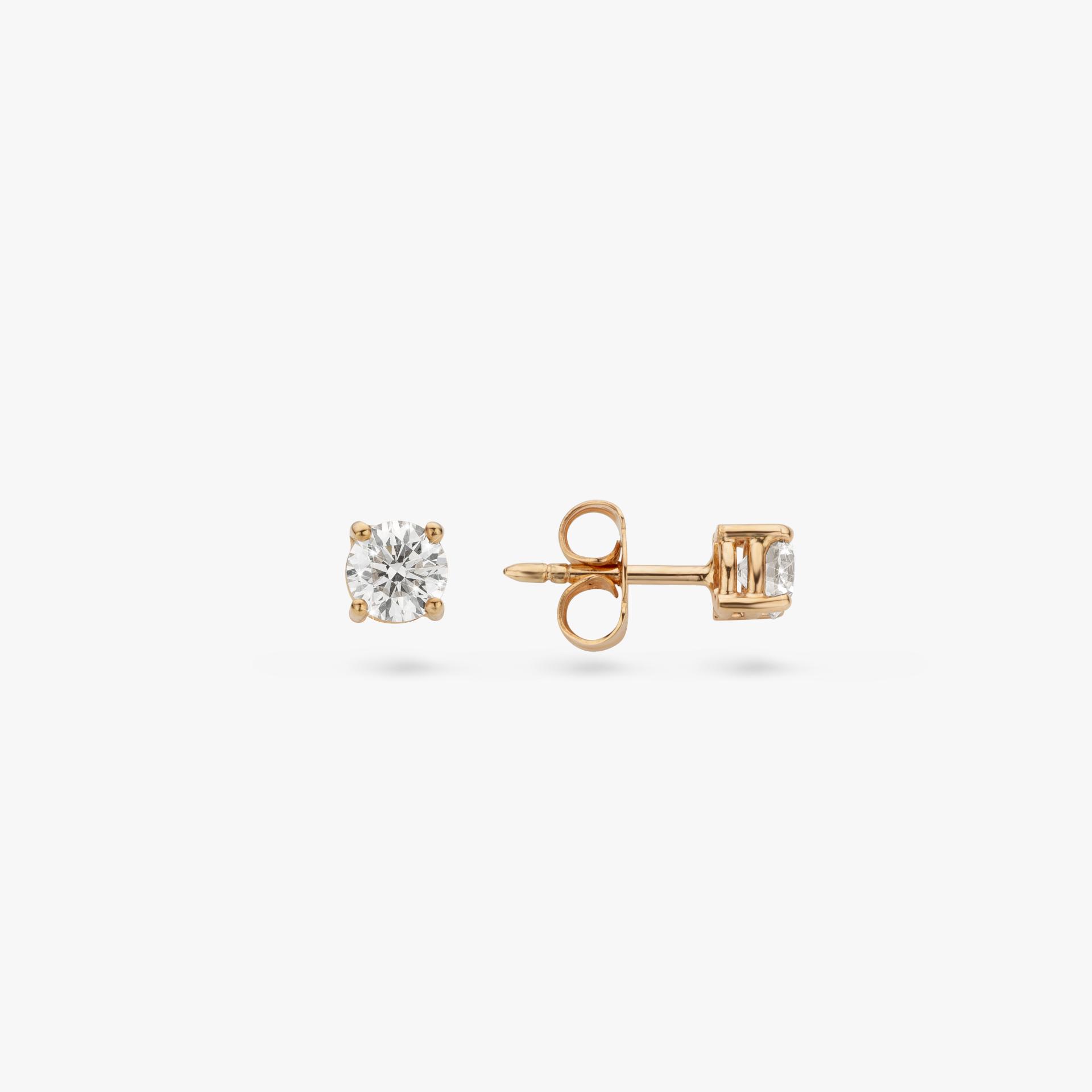 Rose gold earrings set with a brilliant shaped diamond made by Maison De Greef
