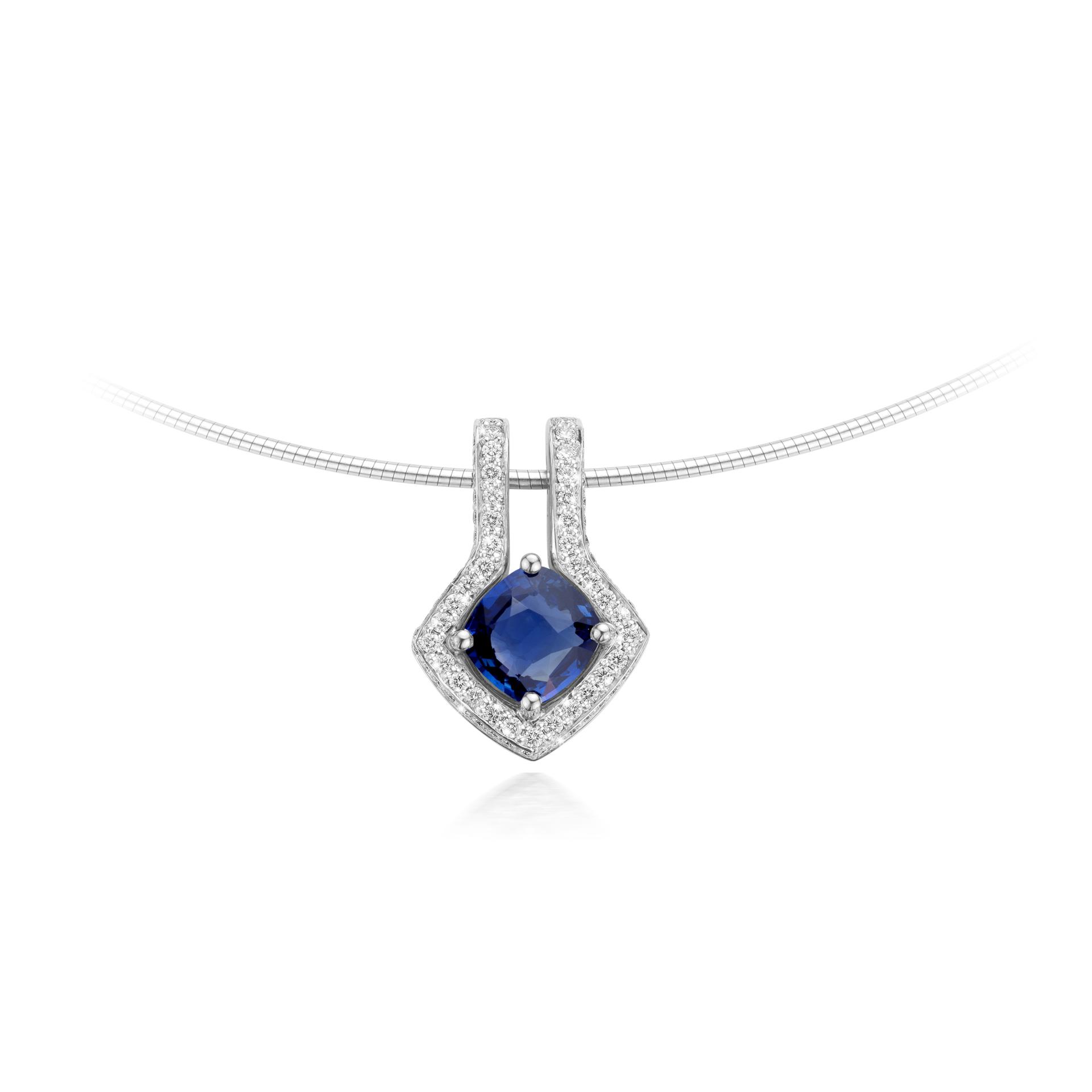 White gold pendant set with blue sapphire and brilliant cut diamonds made by Maison De Greef