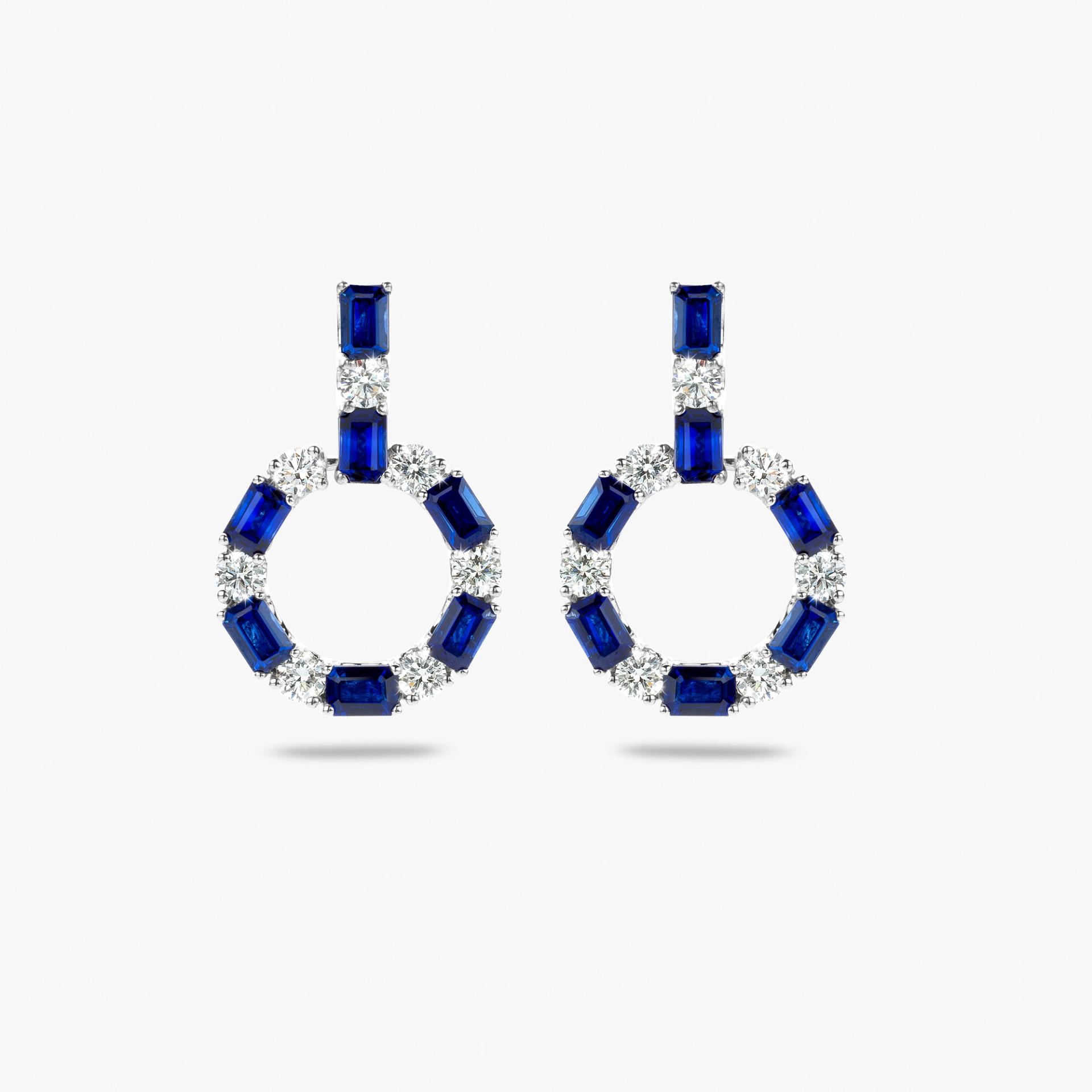 White gold earrings set with blue sapphire and brilliant cut diamonds
 made by Maison De Greef