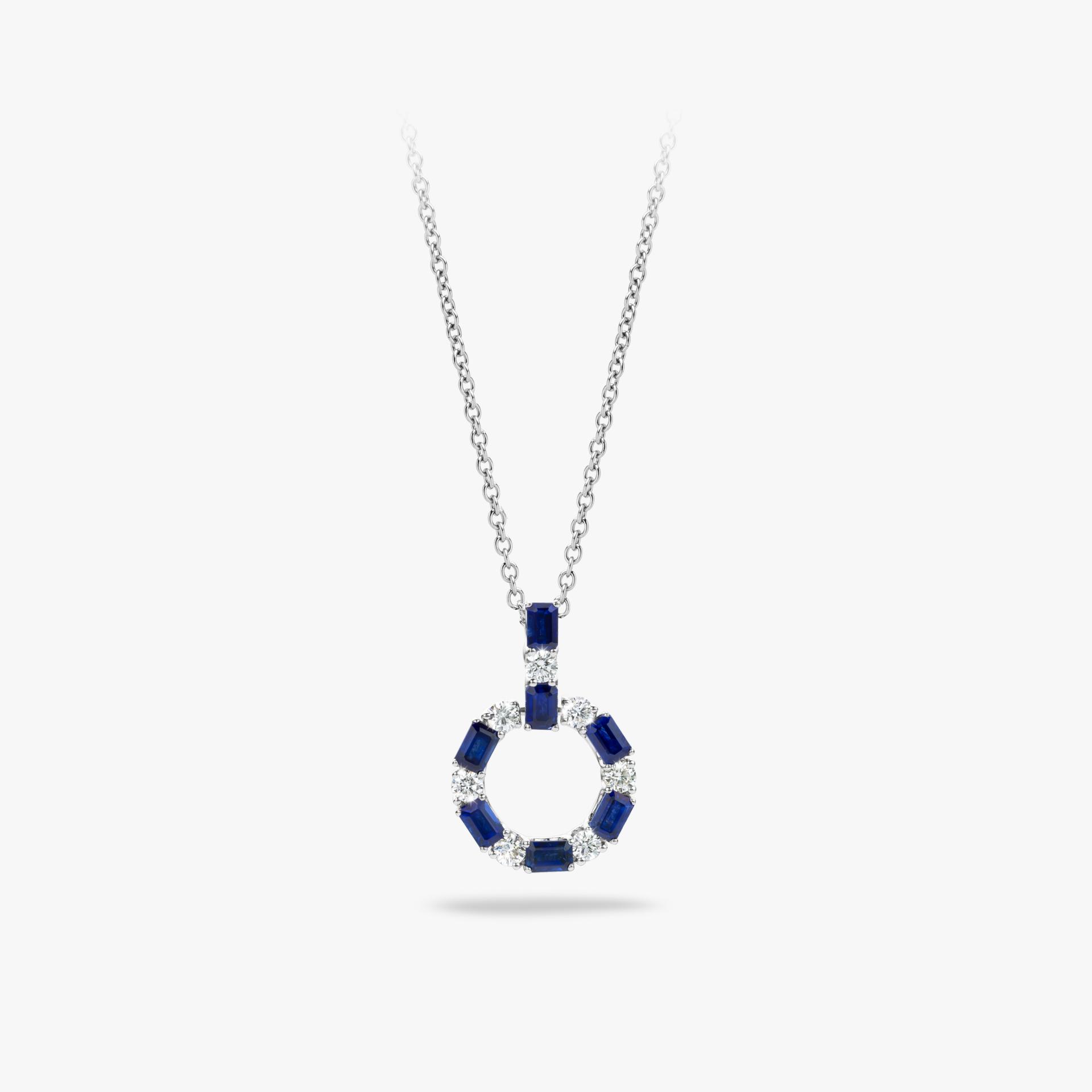 White gold pendant set with blue sapphire and brilliant cut diamonds made by Maison De Greef