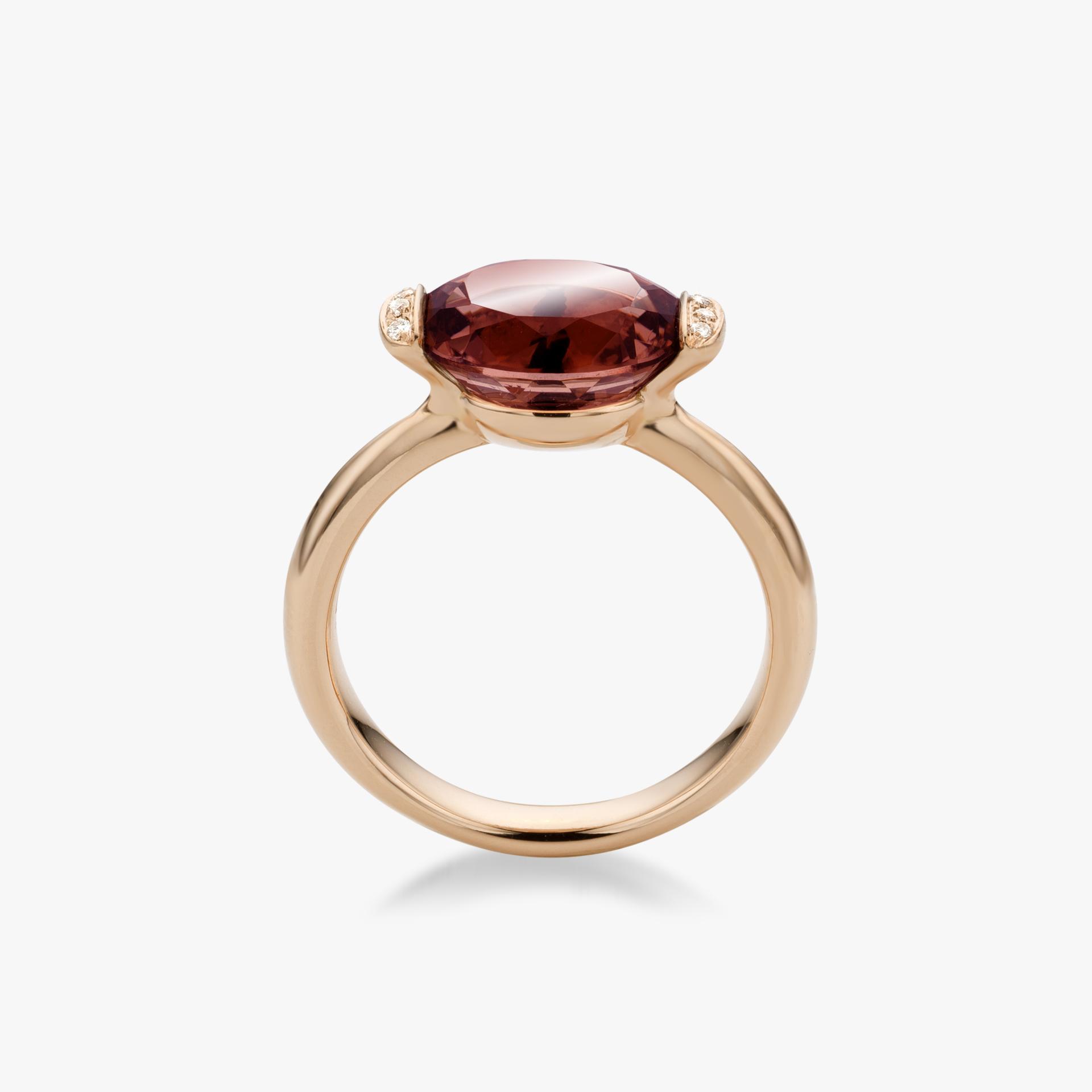 Rose gold ring set with red tourmaline and brilliant cut diamonds  made by Maison De Greef