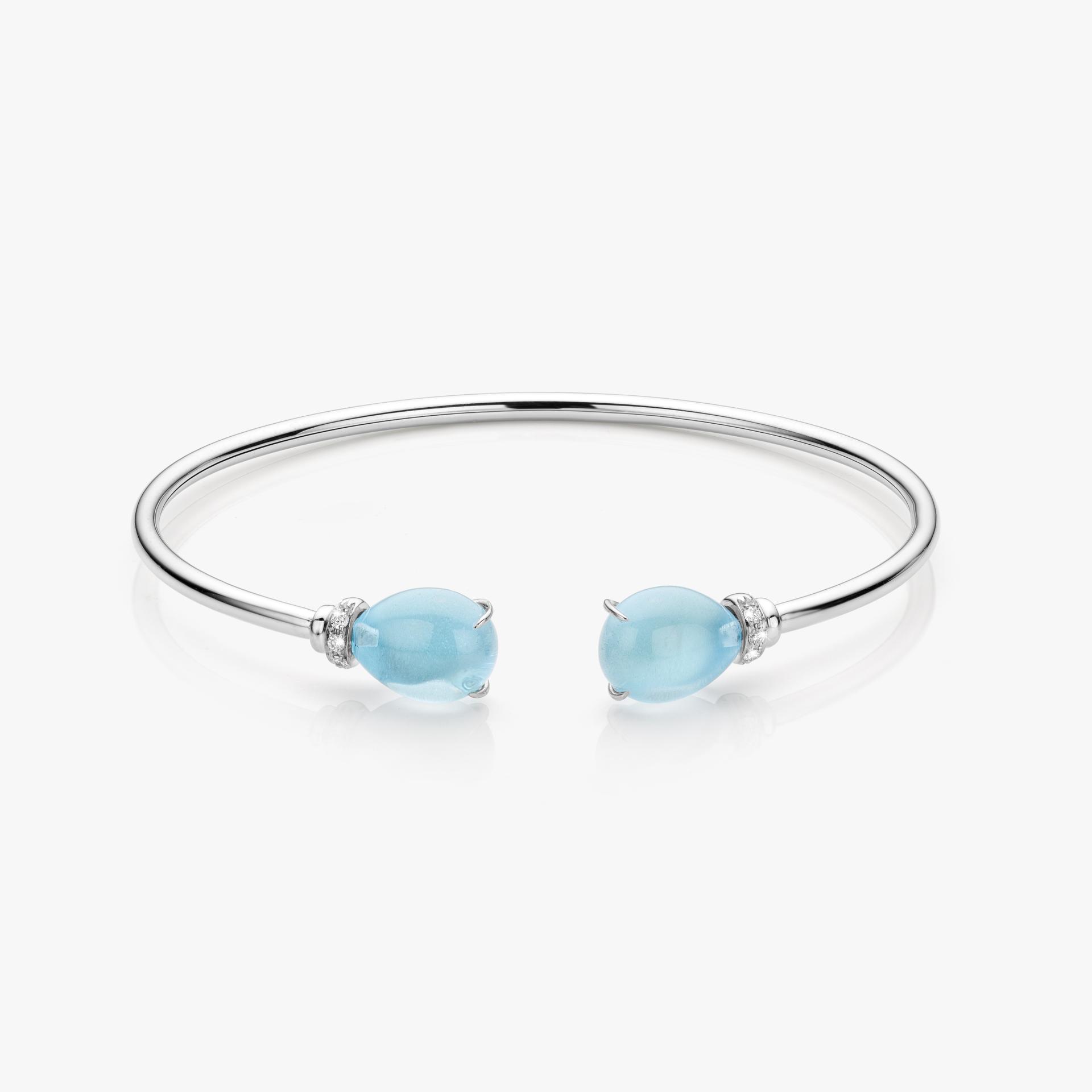 White gold bracelet set with blue topaz and brilliant cut diamonds made by Maison De Greef