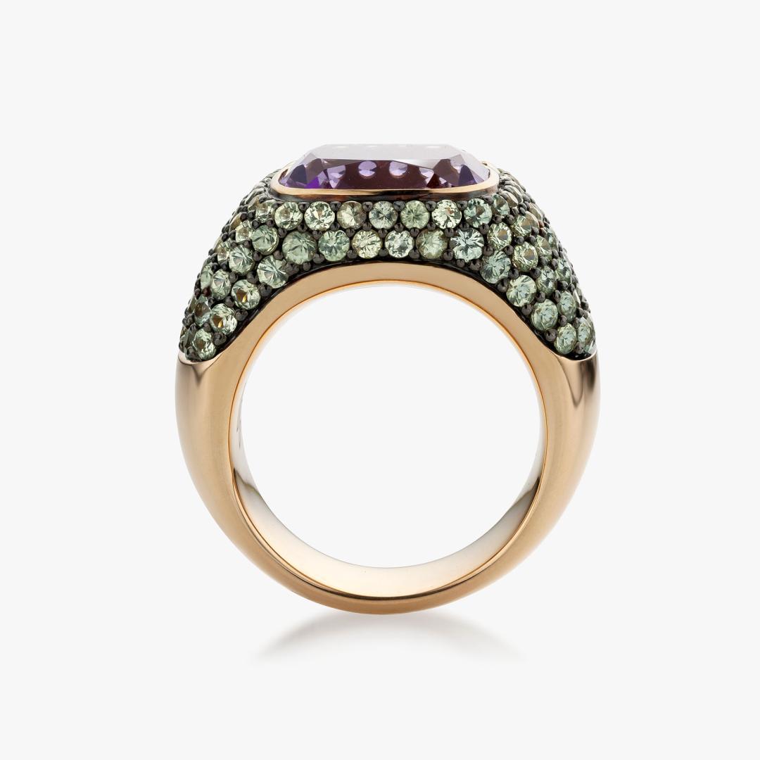 Solis ring in rose gold set with an Amethyst and green sapphires made by Maison De Greef