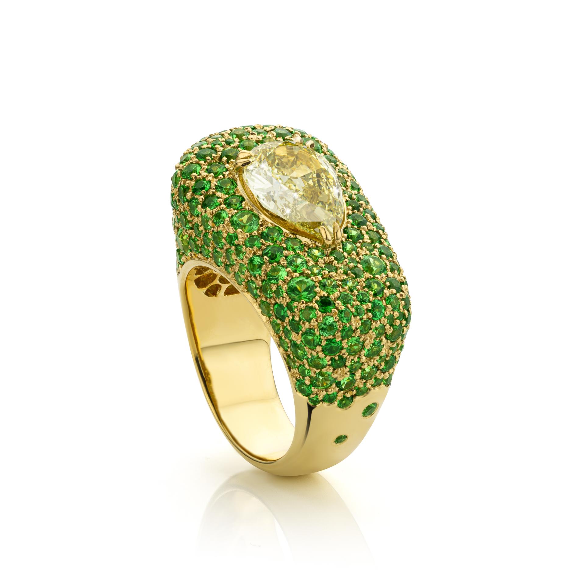 Yellow gold ring set with a yellow diamond and tsavorites made by Maison De Greef