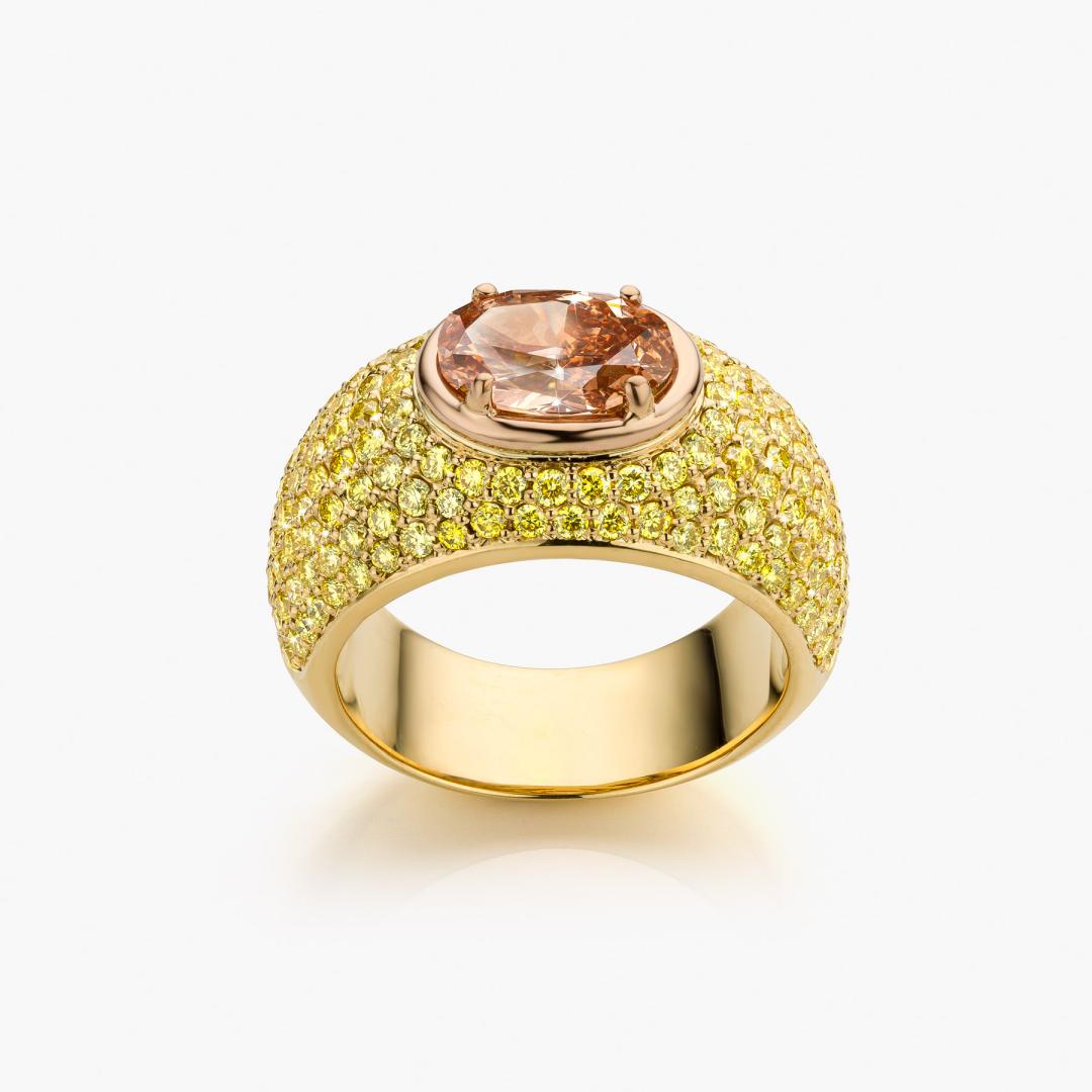 Yellow gold ring set with a brown diamond and yellow diamonds made by Maison De Greef