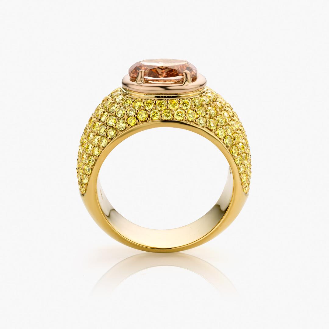 Yellow gold ring set with a brown diamond and yellow diamonds made by Maison De Greef
